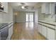 Open-concept kitchen and living room with a sliding glass door to the patio at 3345 E University Dr # 2, Mesa, AZ 85213