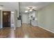 Open floor plan featuring wood floors and kitchen with stainless steel appliances at 3345 E University Dr # 2, Mesa, AZ 85213