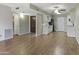 Spacious living area features wood floors, a ceiling fan, and lots of natural light at 3345 E University Dr # 2, Mesa, AZ 85213