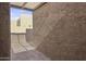 Private exterior patio features a concrete surface and stucco walls at 3345 E University Dr # 2, Mesa, AZ 85213