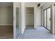 View from the enclosed patio to the living room, closet and exterior patio at 3345 E University Dr # 2, Mesa, AZ 85213