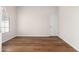 Clean, minimalist bedroom with modern floors, clerestory window offering natural light and neutral walls at 3550 E Topeka Dr, Phoenix, AZ 85050