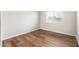 Empty bedroom featuring wood floors and a window at 3550 E Topeka Dr, Phoenix, AZ 85050
