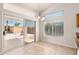 Dining area with patio access and sunlit windows, adjacent to the kitchen at 3550 E Topeka Dr, Phoenix, AZ 85050