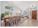 Elegant dining area flowing into the living room, featuring modern decor, neutral colors and lots of natural light at 3550 E Topeka Dr, Phoenix, AZ 85050