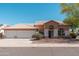 Charming single-story home with a well-maintained front yard and three-car garage, offering great curb appeal at 3550 E Topeka Dr, Phoenix, AZ 85050
