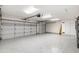 Spacious garage with multiple bays, epoxy floors, built-in cabinets and ample storage space at 3550 E Topeka Dr, Phoenix, AZ 85050