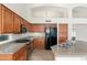 Gourmet kitchen boasts granite counters, stainless steel appliances and ample cabinetry at 3550 E Topeka Dr, Phoenix, AZ 85050