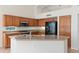 Kitchen with granite countertops and stainless appliances, vaulted ceilings at 3550 E Topeka Dr, Phoenix, AZ 85050