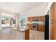 Well-lit kitchen featuring granite countertops, stainless steel appliances, and island at 3550 E Topeka Dr, Phoenix, AZ 85050
