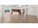 Open-concept living area with tile flooring adjacent to kitchen with granite island at 3550 E Topeka Dr, Phoenix, AZ 85050