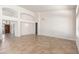 Spacious living room with neutral walls and tile flooring throughout at 3550 E Topeka Dr, Phoenix, AZ 85050