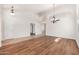 Bright living space with contrasting flooring, high ceilings, designer lighting, and a versatile open layout at 3550 E Topeka Dr, Phoenix, AZ 85050