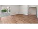 This bright room features wood floors and sliding doors to the patio at 3550 E Topeka Dr, Phoenix, AZ 85050