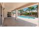 Covered patio offers a seamless transition to the backyard and sparkling pool for entertaining at 3550 E Topeka Dr, Phoenix, AZ 85050