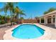 Backyard pool with patio, palm trees and privacy wall, perfect for relaxing and entertaining at 3550 E Topeka Dr, Phoenix, AZ 85050