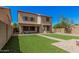 Charming home with a well-kept backyard, patio, and manicured lawn perfect for outdoor enjoyment at 3625 W South Butte Rd, San Tan Valley, AZ 85144