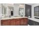 Modern bathroom with double sink vanity, granite countertops, stylish tile and soaking tub at 3625 W South Butte Rd, San Tan Valley, AZ 85144