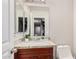 Bathroom with a single sink vanity, granite countertop and mirrored cabinet at 3625 W South Butte Rd, San Tan Valley, AZ 85144