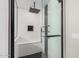 Contemporary glass enclosed shower with black fixtures and shower head at 3625 W South Butte Rd, San Tan Valley, AZ 85144