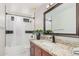 Bathroom with granite countertops, dark wood vanity, and combined tub and shower at 3625 W South Butte Rd, San Tan Valley, AZ 85144