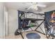 This bedroom features a loft bed with a built-in desk underneath at 3625 W South Butte Rd, San Tan Valley, AZ 85144