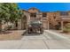 Two-story home with arched entry, balcony and basketball hoop over garage at 3625 W South Butte Rd, San Tan Valley, AZ 85144