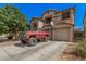 Two-story home with arched entry and basketball hoop over garage at 3625 W South Butte Rd, San Tan Valley, AZ 85144