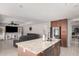 Open kitchen with granite countertops, dark wood cabinets, and stainless appliances at 3625 W South Butte Rd, San Tan Valley, AZ 85144