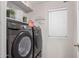 Convenient laundry room equipped with modern washer and dryer units and storage at 3625 W South Butte Rd, San Tan Valley, AZ 85144