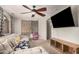 Comfortable living room features sectional seating, window and TV at 3625 W South Butte Rd, San Tan Valley, AZ 85144
