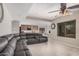 Spacious living room with tiled floors, modern lighting, and sectional sofa at 3625 W South Butte Rd, San Tan Valley, AZ 85144