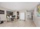 Neutral living room with tiled floors, rolling whiteboard, arched hallway at 3625 W South Butte Rd, San Tan Valley, AZ 85144