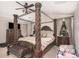 Spacious main bedroom featuring a decorative four-poster bed and coordinating furniture at 3625 W South Butte Rd, San Tan Valley, AZ 85144
