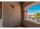 Private patio featuring textured walls and a window overlooking the neighborhood at 3625 W South Butte Rd, San Tan Valley, AZ 85144