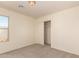 Neutral bedroom features carpet and a closet with sliding doors for simple storage at 38191 W Merced St, Maricopa, AZ 85138