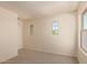 Carpeted bedroom boasts multiple arched windows, providing great natural light at 38191 W Merced St, Maricopa, AZ 85138