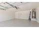 Spacious garage with epoxy flooring, water heater and ample room for parking at 38191 W Merced St, Maricopa, AZ 85138