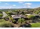 Aerial view of this home with private backyard, covered patio, and golf course adjacent to the neighborhood at 42105 N Golf Crest Rd, Anthem, AZ 85086