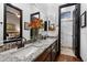 Modern bathroom featuring double sinks with granite countertops and a glass-enclosed shower with tiled walls and pebble floor at 42105 N Golf Crest Rd, Anthem, AZ 85086