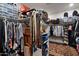 Walk-in closet with ample storage space and customized shelving at 42105 N Golf Crest Rd, Anthem, AZ 85086