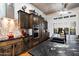 Updated kitchen with stainless steel appliances, granite countertops, wood cabinets and adjacent breakfast bar at 42105 N Golf Crest Rd, Anthem, AZ 85086