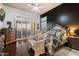 Bright main bedroom with shutters, dark accent walls, and hardwood floors at 42105 N Golf Crest Rd, Anthem, AZ 85086