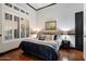 Cozy main bedroom with large windows, plush bedding, and tasteful decor at 42105 N Golf Crest Rd, Anthem, AZ 85086