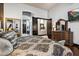 A well-appointed main bedroom with a decorative bed, dresser, and access to the bathroom at 42105 N Golf Crest Rd, Anthem, AZ 85086