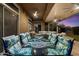 Entertainer's backyard with ample seating under the covered patio with ceiling fans and beautiful landscape views at 42105 N Golf Crest Rd, Anthem, AZ 85086