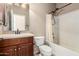 Cozy bathroom with classic fixtures, vanity sink, and a shower-tub combination, perfect for guests at 42616 W Avella Dr, Maricopa, AZ 85138