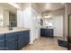 This bathroom features a double vanity and a separate area for the shower and toilet at 42616 W Avella Dr, Maricopa, AZ 85138