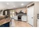 Spacious kitchen boasts stainless steel appliances, granite countertops, and an open layout at 42616 W Avella Dr, Maricopa, AZ 85138