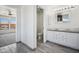 Well-lit bathroom with double sinks and granite countertops at 45647 W Starlight Dr, Maricopa, AZ 85139